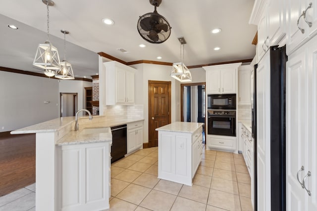 kitchen featuring black appliances, a center island, tasteful backsplash, white cabinets, and decorative light fixtures