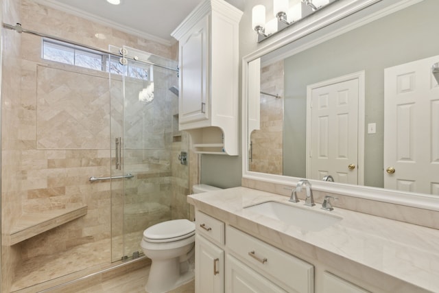 bathroom featuring toilet, hardwood / wood-style flooring, walk in shower, ornamental molding, and vanity