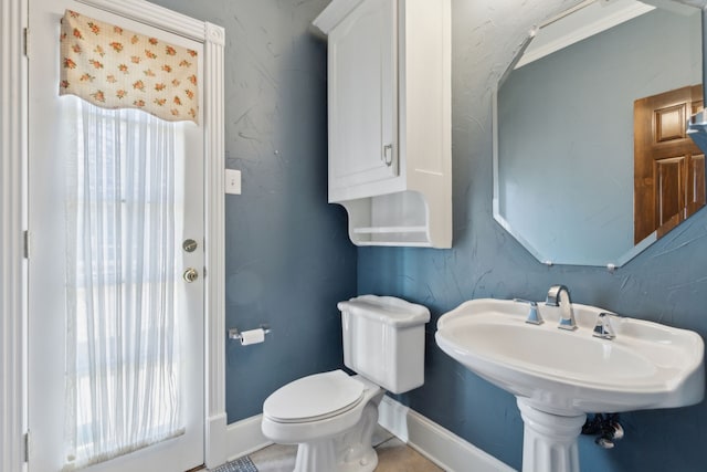 bathroom featuring sink and toilet