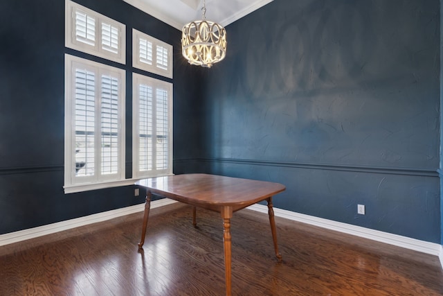 unfurnished office with crown molding, hardwood / wood-style floors, and an inviting chandelier