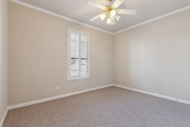 carpeted empty room with ceiling fan and crown molding