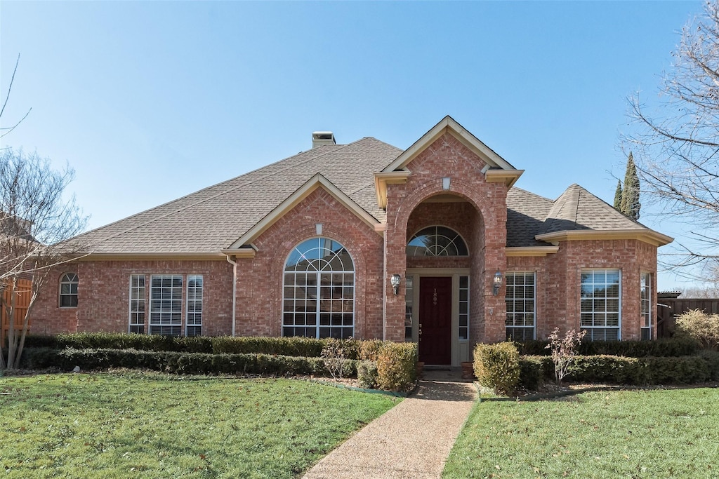 front facade with a front lawn