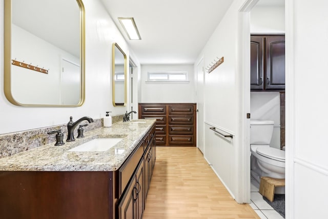 bathroom featuring hardwood / wood-style floors, toilet, and vanity