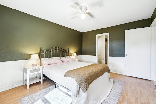 bedroom featuring ceiling fan and light hardwood / wood-style flooring