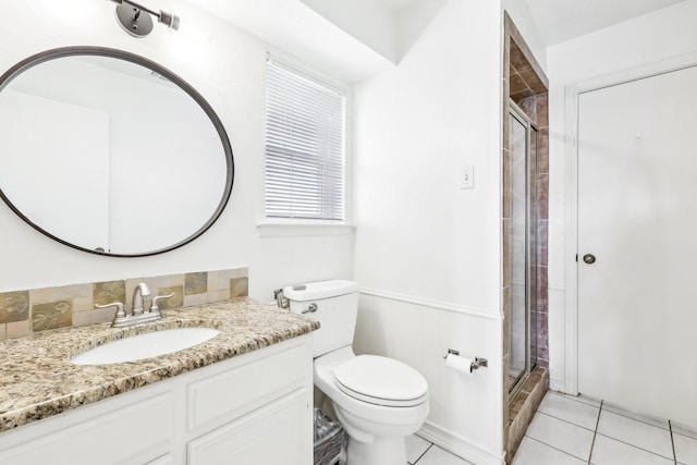 bathroom with vanity, backsplash, tile patterned floors, and a shower with shower door