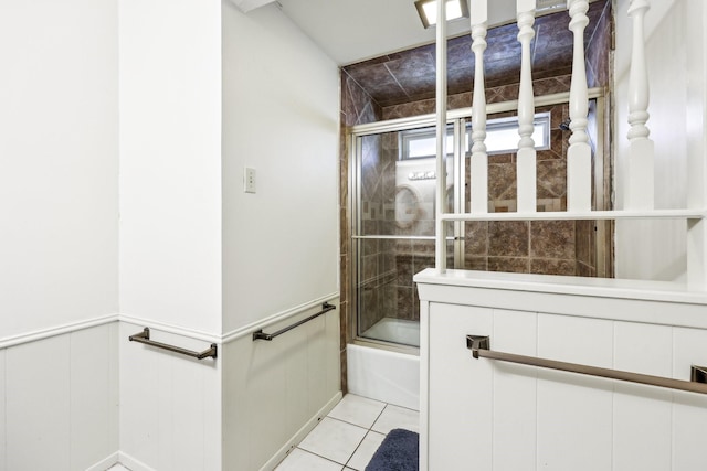 bathroom with enclosed tub / shower combo and tile patterned floors