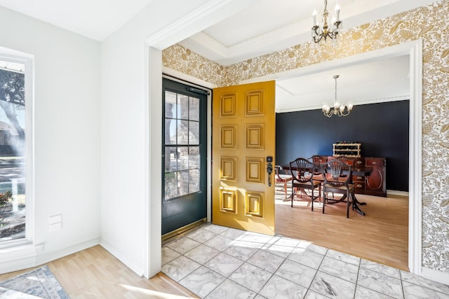 foyer featuring a notable chandelier