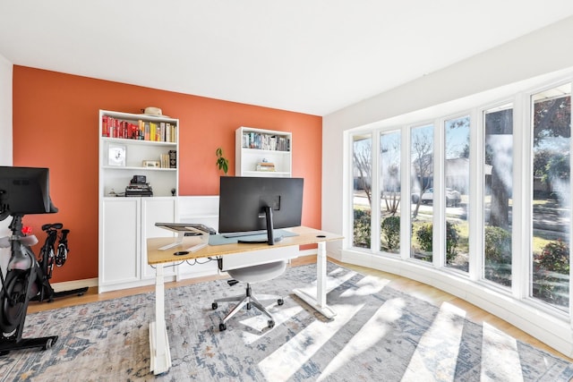 office with light hardwood / wood-style flooring