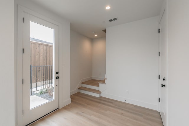 doorway with light wood-type flooring