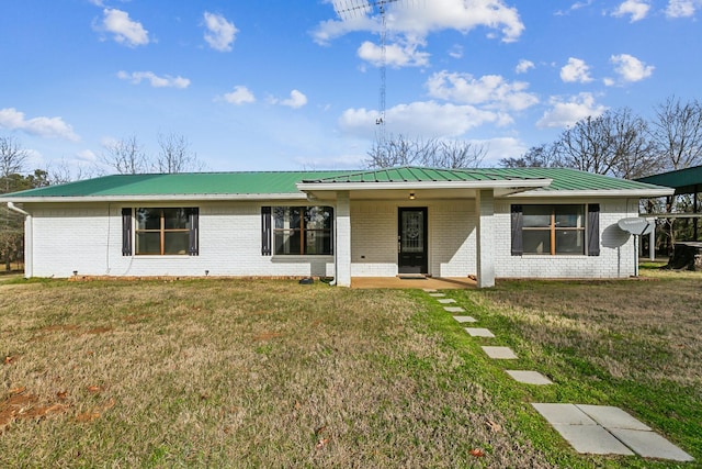 ranch-style home with a front lawn