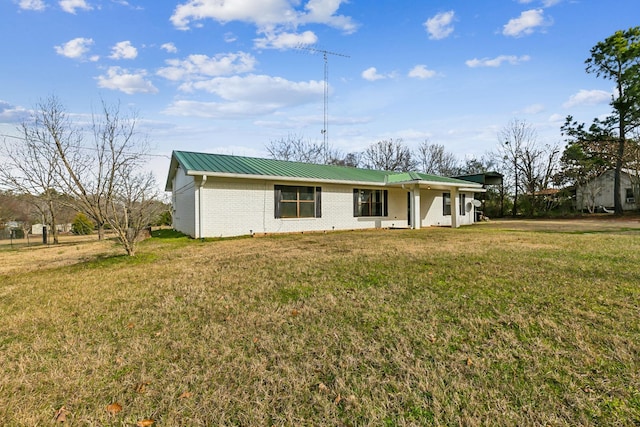 ranch-style home featuring a front yard