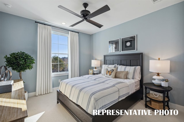 carpeted bedroom with ceiling fan