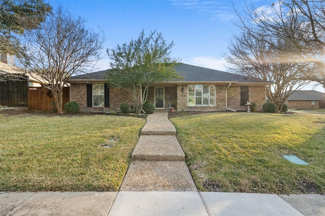 single story home featuring a front lawn