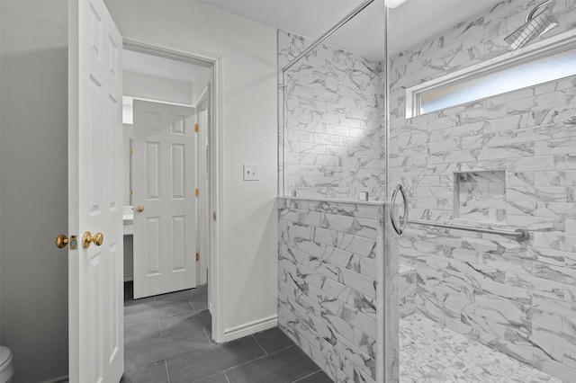 bathroom featuring a shower with door