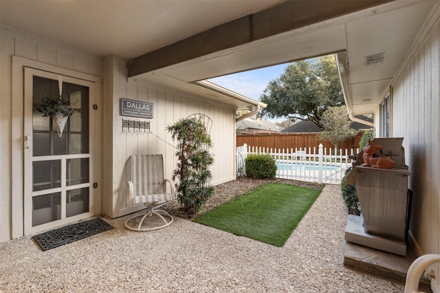 view of yard featuring a fenced in pool and a patio