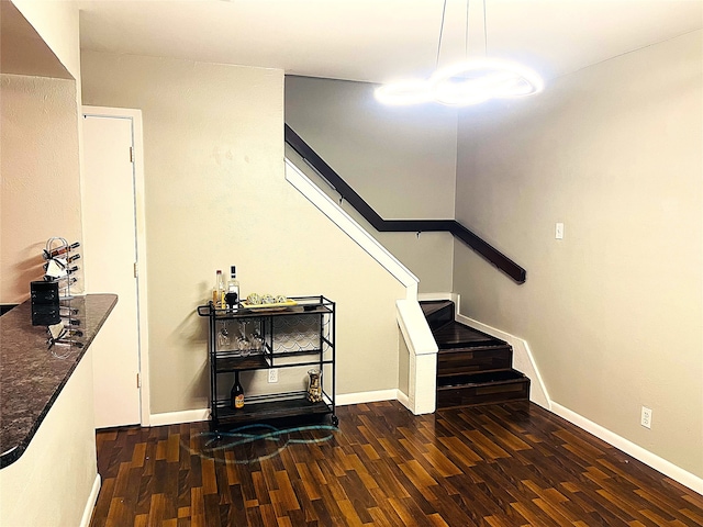 stairway featuring hardwood / wood-style floors