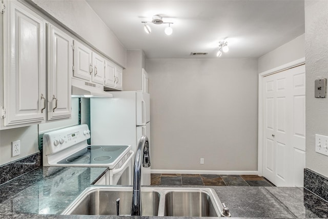 kitchen featuring electric stove, white cabinetry, and sink