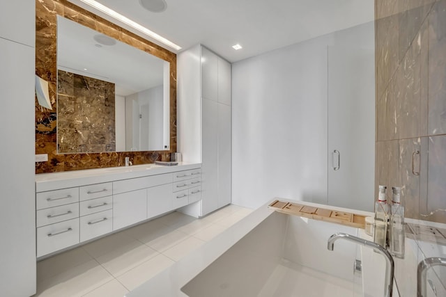 bathroom featuring vanity, tile walls, and tile patterned flooring