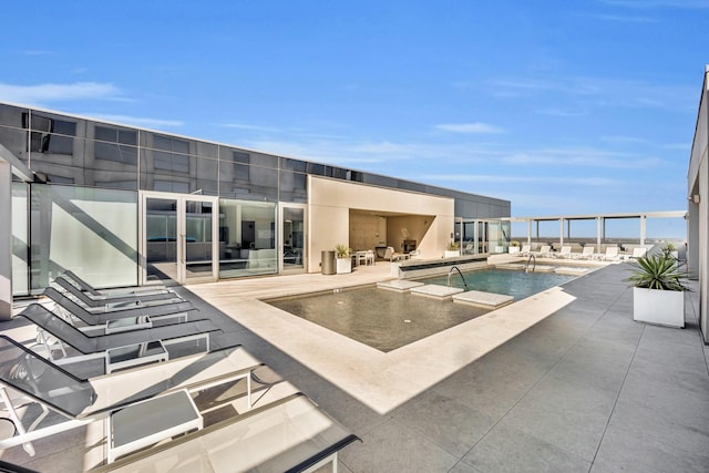 view of swimming pool with a patio area