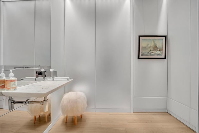 bathroom with hardwood / wood-style floors