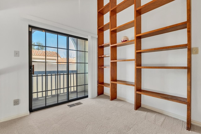 spare room with light colored carpet