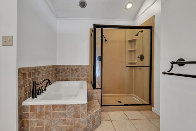 bathroom with a textured ceiling, tile patterned floors, lofted ceiling, and shower with separate bathtub