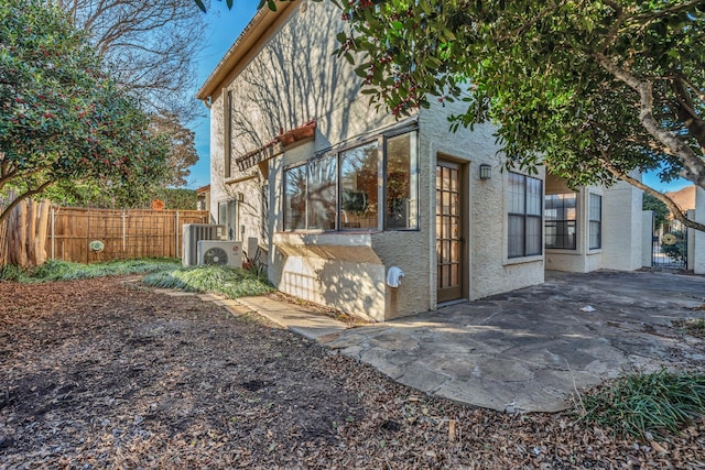 exterior space featuring a patio area and ac unit