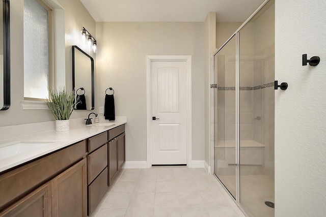 bathroom with vanity, tile patterned floors, and walk in shower