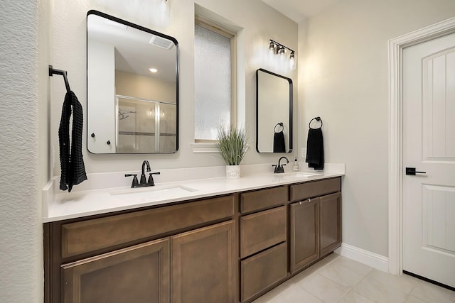 bathroom with vanity, tile patterned floors, and a shower with shower door