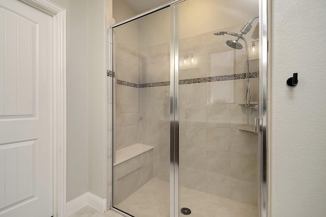 bathroom with a shower with shower door