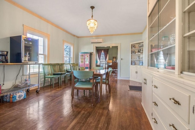 dining area with crown molding, built in shelves, dark hardwood / wood-style floors, an AC wall unit, and a notable chandelier