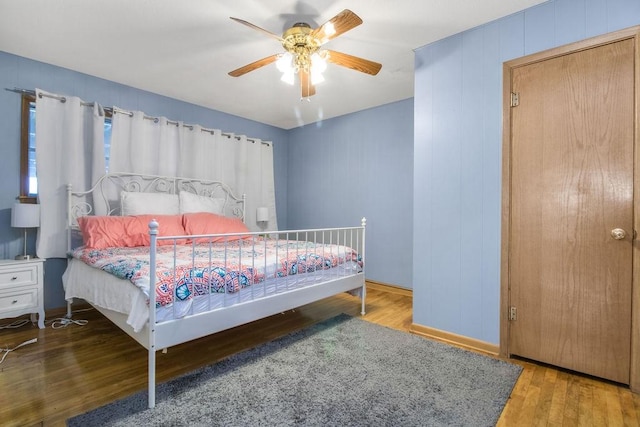 bedroom featuring ceiling fan and hardwood / wood-style floors