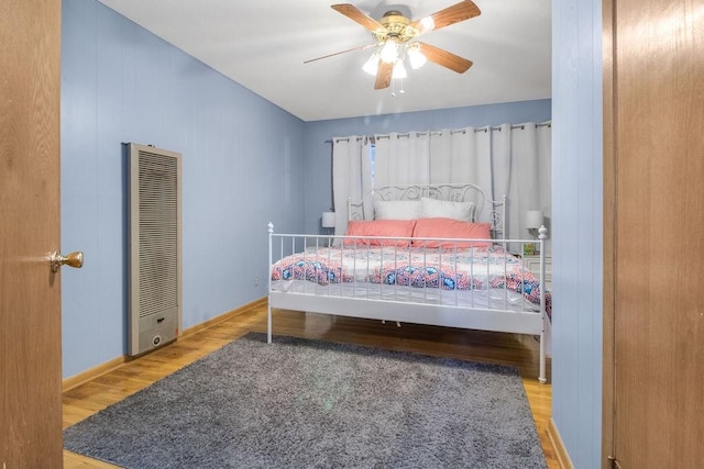 bedroom featuring ceiling fan and wood-type flooring