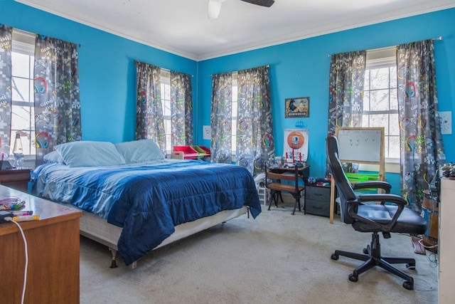 carpeted bedroom featuring ceiling fan, multiple windows, and crown molding