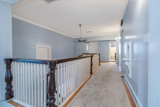 corridor featuring light colored carpet and ornamental molding