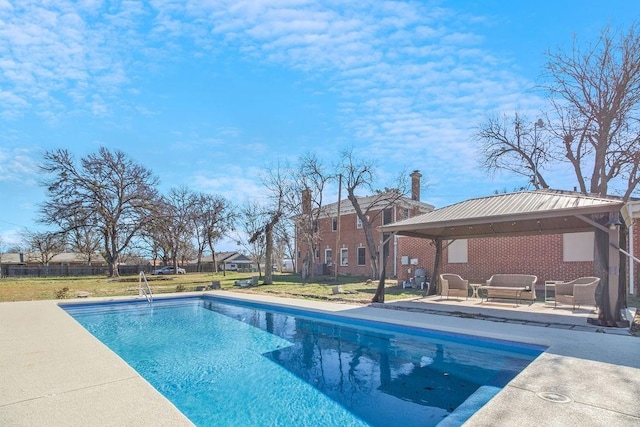 view of swimming pool with a patio area, a gazebo, and outdoor lounge area