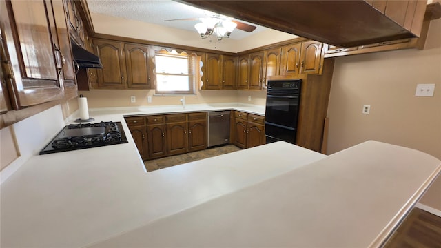 kitchen featuring black appliances, ceiling fan, and kitchen peninsula