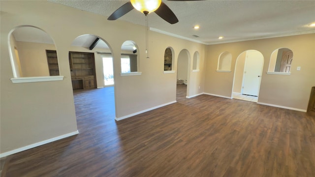 spare room featuring a textured ceiling, dark hardwood / wood-style floors, and ceiling fan