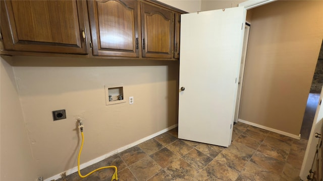 clothes washing area with cabinets, washer hookup, and hookup for an electric dryer