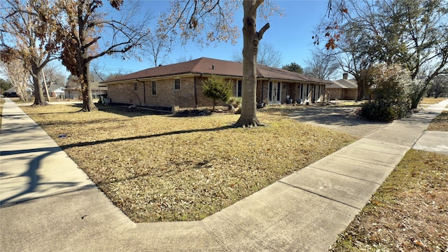 view of property exterior with a lawn