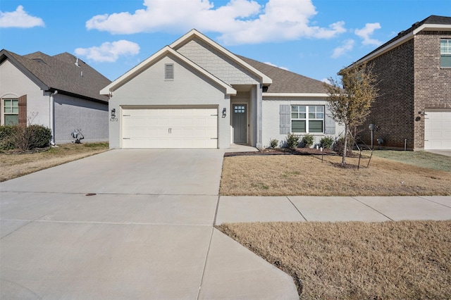 view of front of property with a front yard and a garage