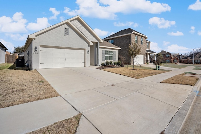 ranch-style house with a front yard and central air condition unit