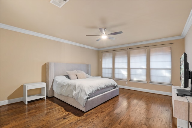 bedroom featuring ceiling fan, dark hardwood / wood-style flooring, and crown molding