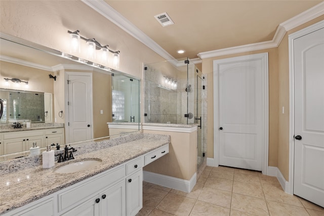 bathroom featuring an enclosed shower, vanity, crown molding, and tile patterned flooring