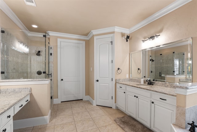 bathroom with vanity, ornamental molding, an enclosed shower, and tile patterned flooring