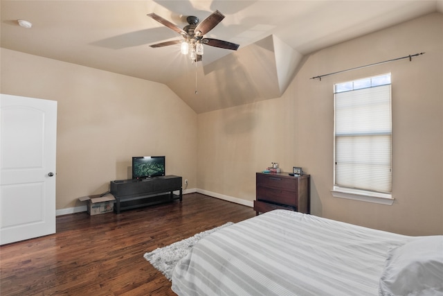 bedroom featuring ceiling fan, dark wood-type flooring, and vaulted ceiling