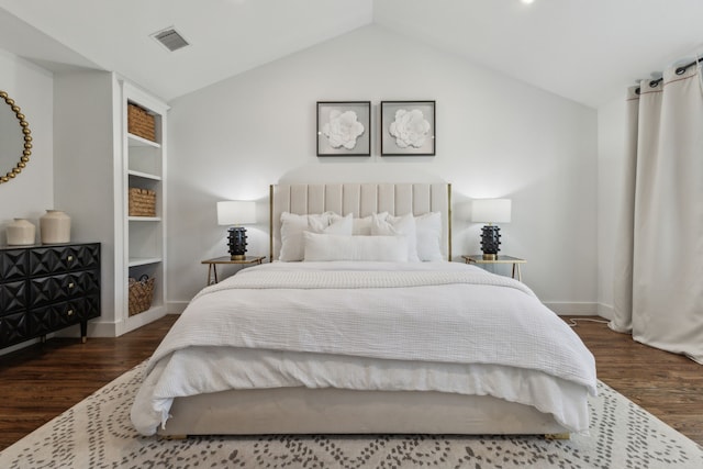 bedroom with dark hardwood / wood-style flooring and vaulted ceiling