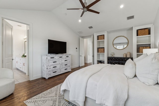 bedroom featuring ceiling fan, wood-type flooring, connected bathroom, and lofted ceiling