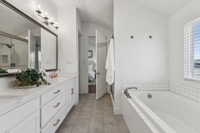 bathroom with tile patterned flooring, vanity, and independent shower and bath