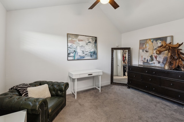 sitting room featuring vaulted ceiling, light colored carpet, and ceiling fan